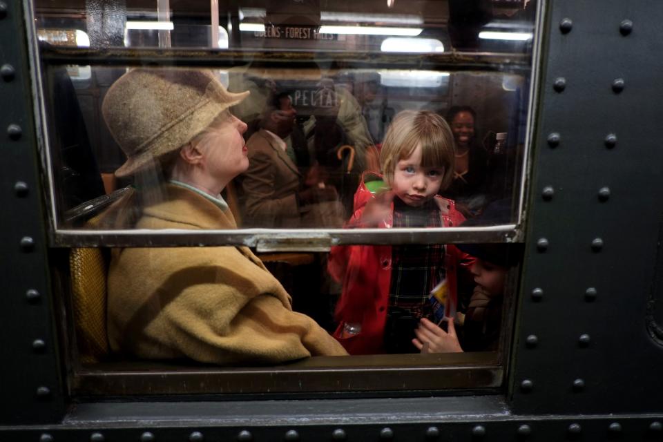 Riders Enjoy Vintage New York City Subway Trains In Annual Holiday Tradition