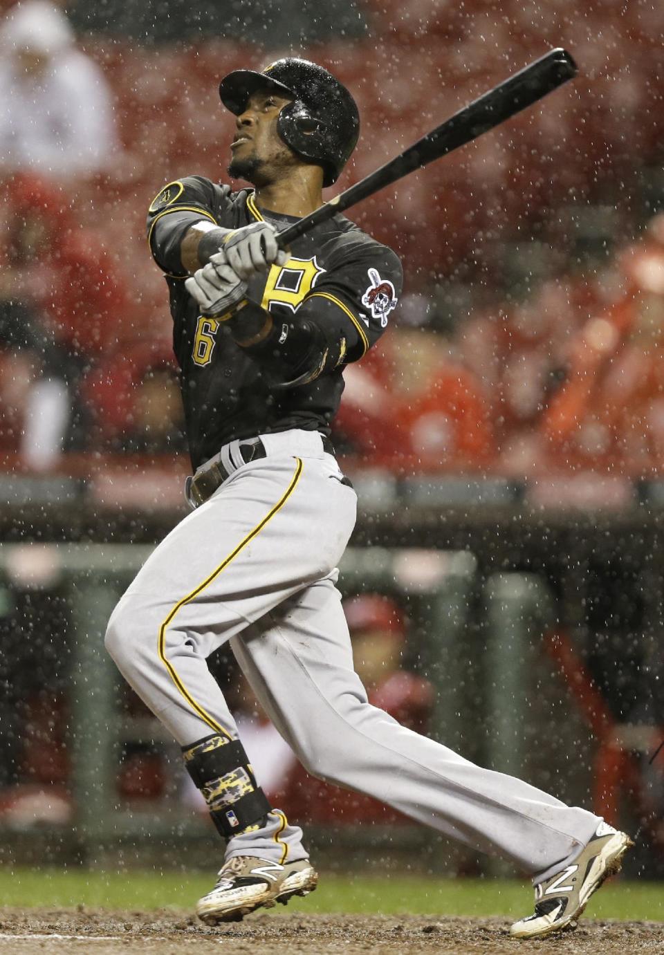 Pittsburgh Pirates' Starling Marte hits a solo home run off Cincinnati Reds starting pitcher Homer Bailey in the fifth inning of a baseball game, Monday, April 14, 2014, in Cincinnati. (AP Photo/Al Behrman)