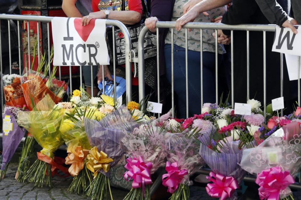 Crowds laid flowers at the vigil (AP)