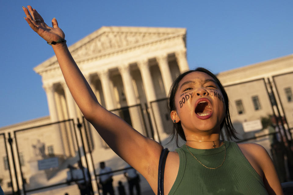 An Abortion rights activist Gwak chants in front of the Supreme Court (Nathan Howard / Getty Images file)