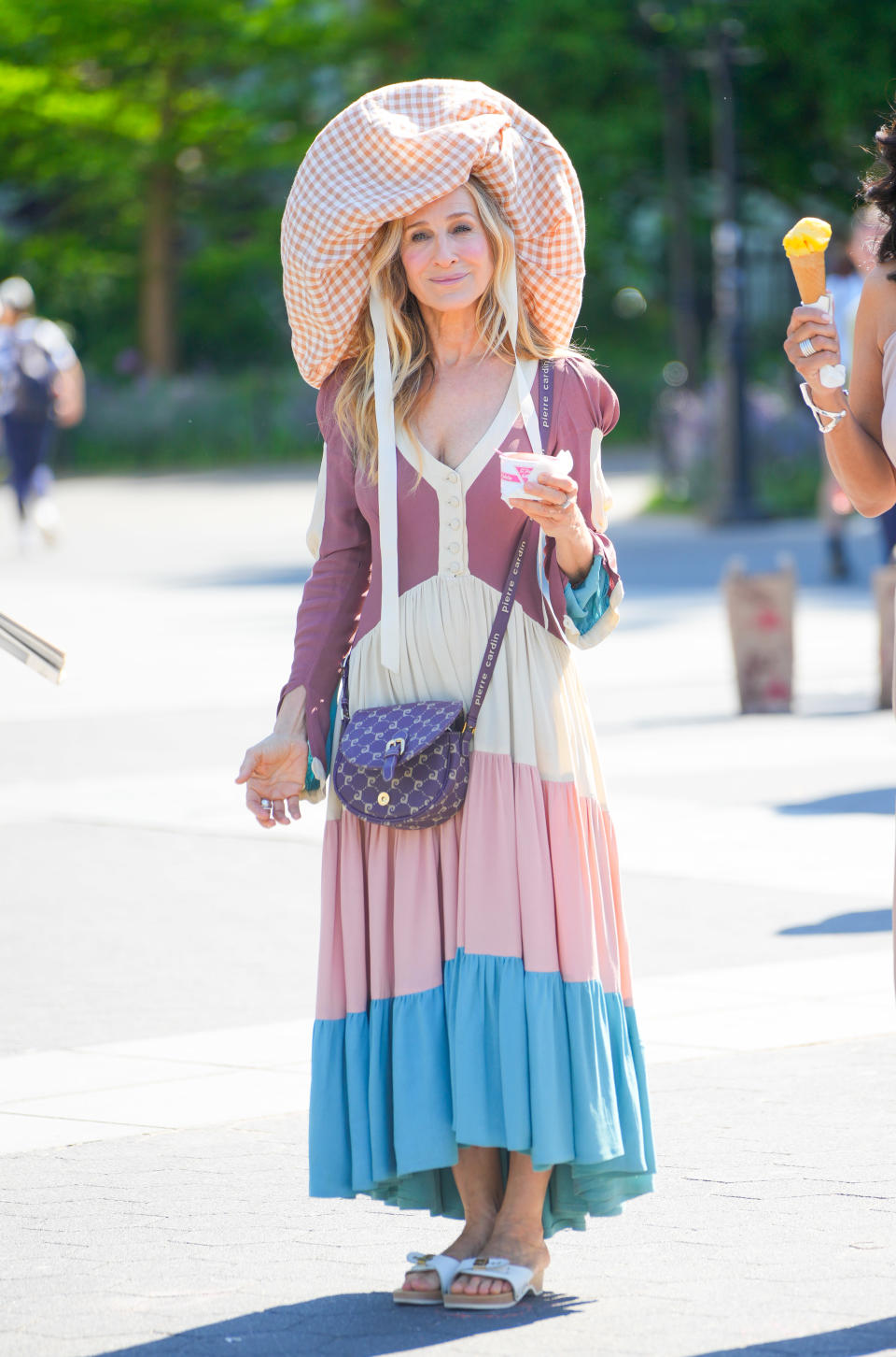 Sarah Jessica Parker is seen on location for 'And Just Like That' wearing Dr. Scholl's' Original sandals.