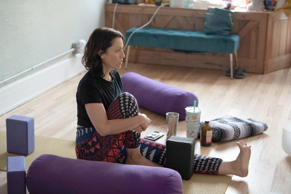 Melanie Chavez leads yoga class at her Ren Yoga Flow studio on June 23.