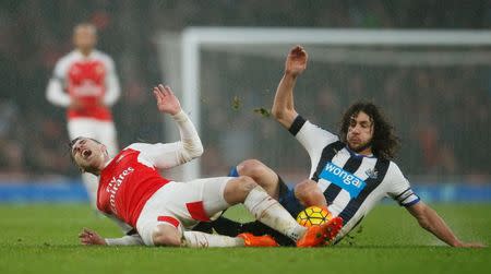 Football Soccer - Arsenal v Newcastle United - Barclays Premier League - Emirates Stadium - 2/1/16 Arsenal's Aaron Ramsey in action with Newcastle's Fabricio Coloccini Action Images via Reuters / Andrew Couldridge Livepic