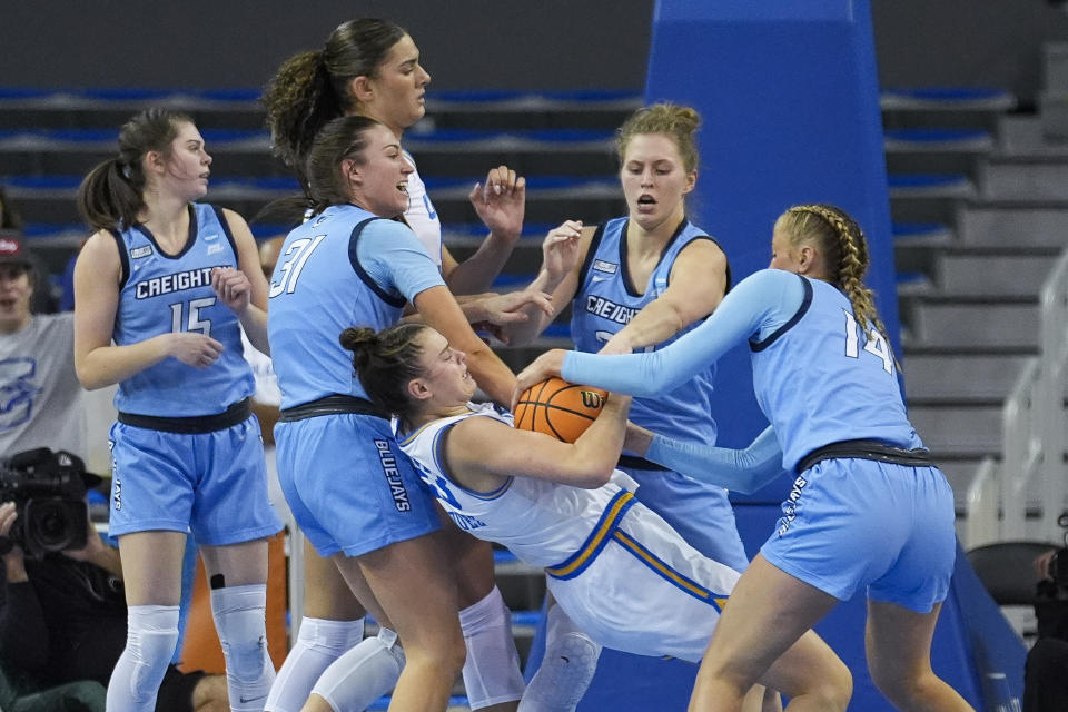 UCLA forward Gabriela Jaquez, middle, works for a rebound against a group of Creighton defenders during the first half of a second-round college basketball game in the women's NCAA Tournament, Monday, March 25, 2024, in Los Angeles. (AP Photo/Marcio Jose Sanchez)
