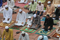 Indian Muslims wear masks as precaution against coronavirus and offer Eid al-Adha prayer at the Jama Masjid in New Delhi, India, Saturday, Aug.1, 2020. Eid al-Adha, or the Feast of the Sacrifice, by sacrificing animals to commemorate the prophet Ibrahim's faith in being willing to sacrifice his son. (AP Photo/Manish Swarup)