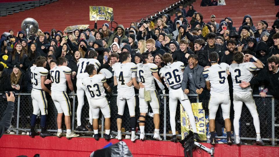 Members of the Old Tappan football team celebrate with their fans  after Old Tappan defeated Delsea, 24-14, in the NJSIAA State Group 3 football championship game played at Rutgers' SHI Stadium in Piscataway on Saturday, December 3, 2022.  