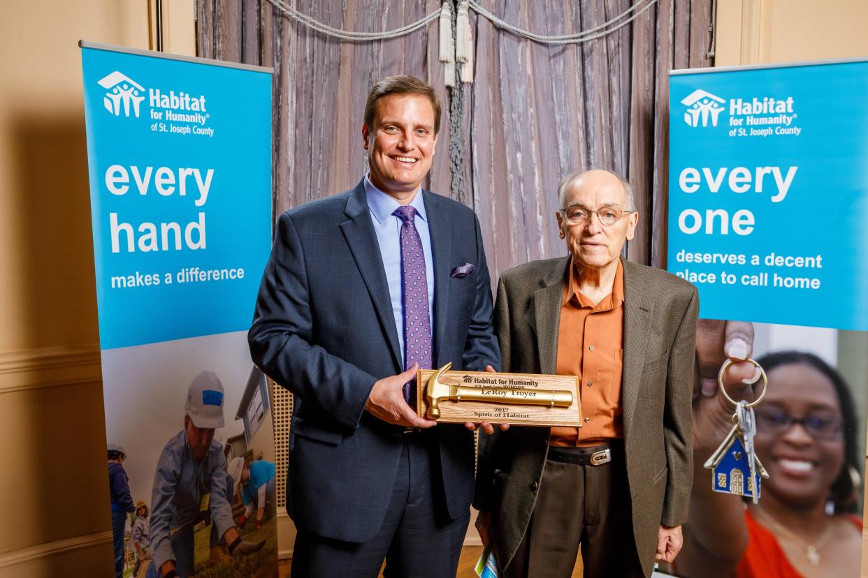 Jim Williams, left, presents the Spirit of Habitat Award to LeRoy Troyer in 2017. Williams, CEO and president of Habitat for Humanity of St. Joseph County, recently received the Sagamore of the Wabash Award.