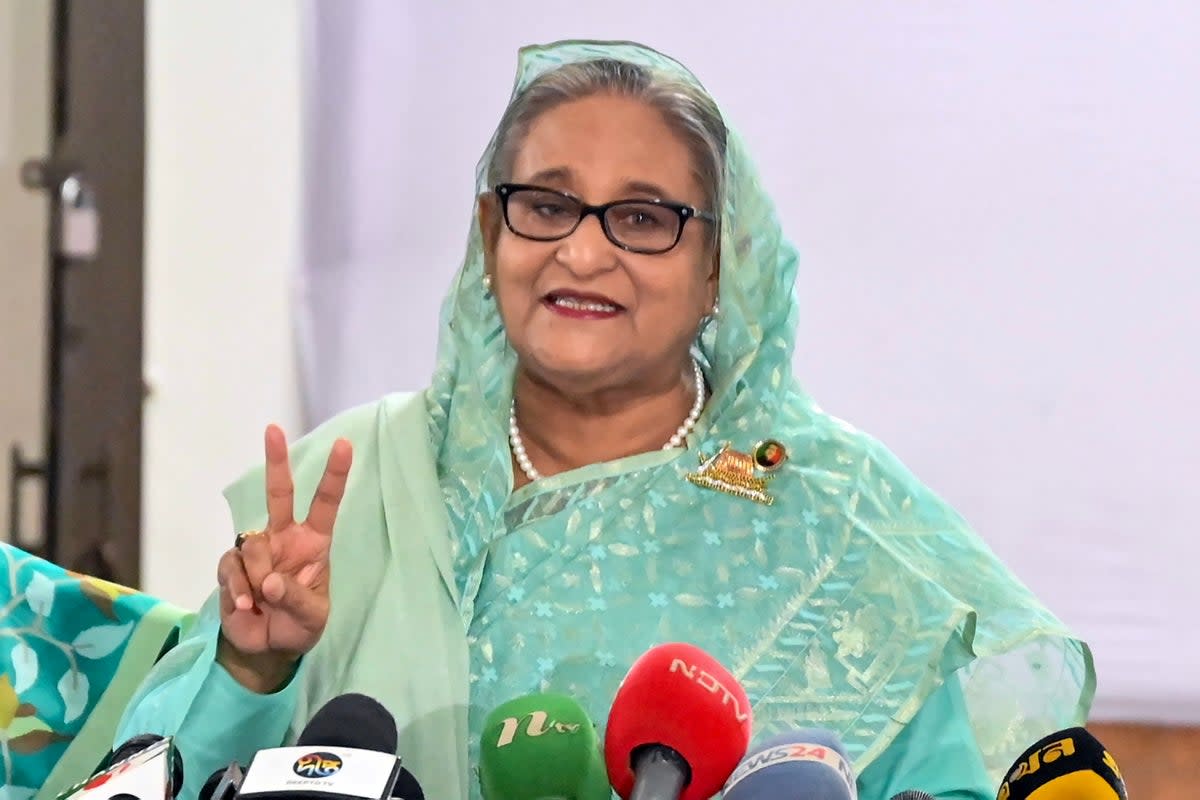 Bangladesh's Prime Minister Sheikh Hasina gestures after casting her vote casts at a polling station in Dhaka (AFP via Getty Images)