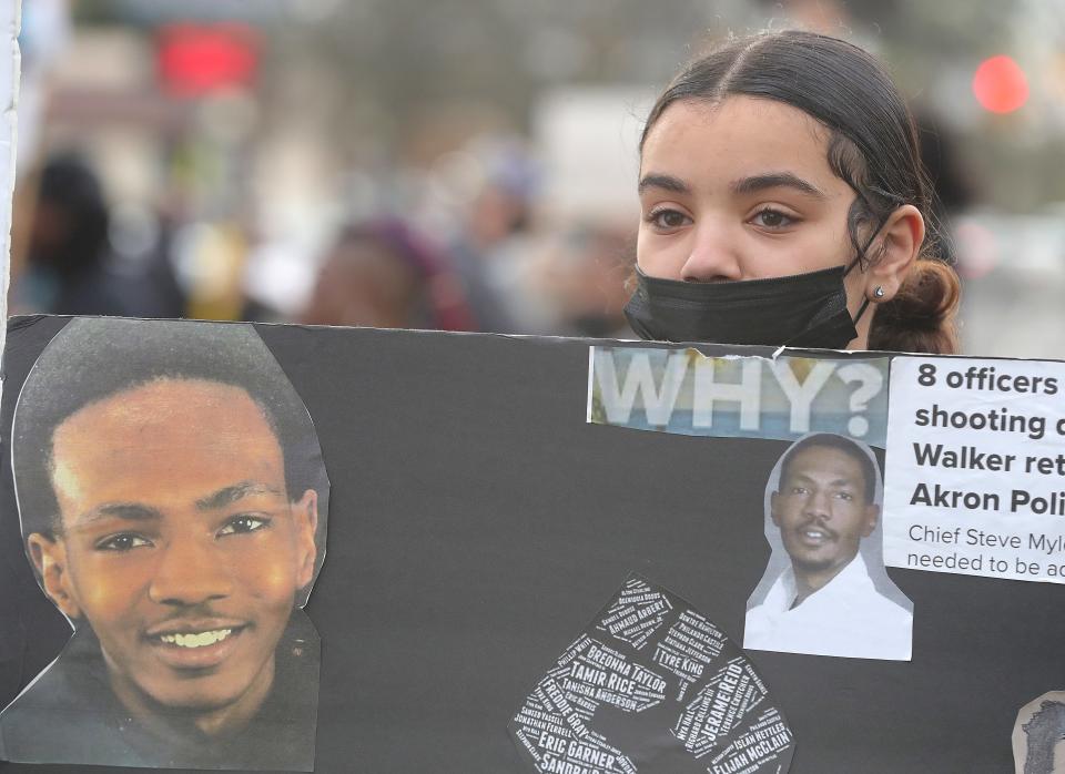 Trista Vance stands with Justice for Jayland Walker protesters Friday in Highland Square.