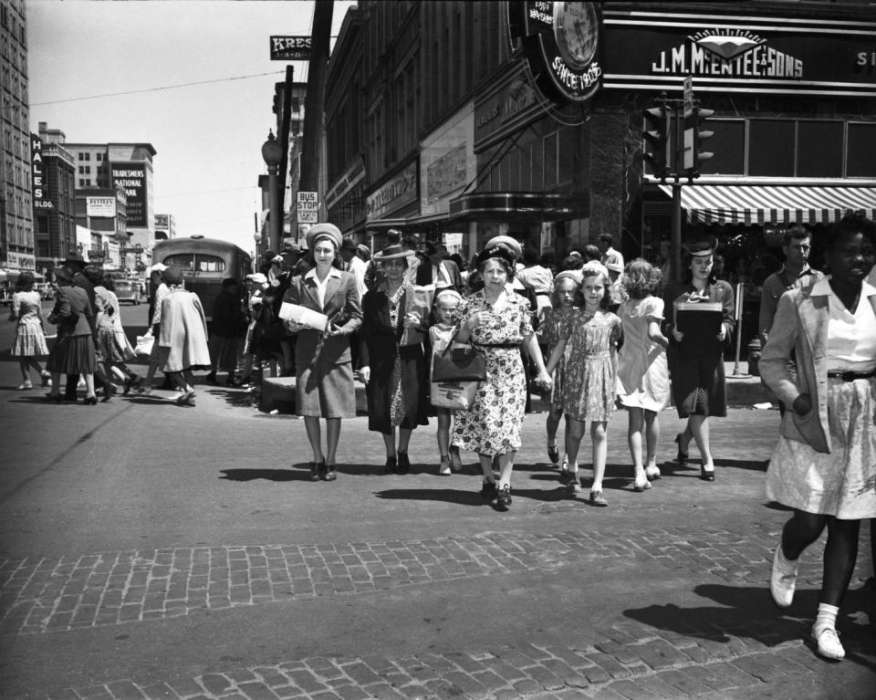 In 1946, several shoppers carry packages as they walk in the 200 block of Main Street in downtown Oklahoma City.