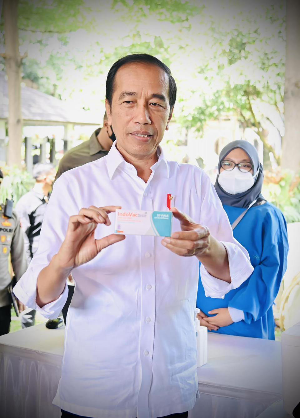In this photo released by the Press and Media Bureau of the Indonesian Presidential Palace, Indonesian President Joko Widodo shows a box of IndoVac COVID-19 vaccine during the launch of the country's first home-grown COVID-19 vaccine, IndoVac in Bandung, West Java , Indonesia, Thursday, Oct 13, 2022. Indonesian leader on Thursday launched the country's first home-grown COVID-19 vaccine to help reduce the world's fourth most populous nation's dependency on imported vaccines. (Laily Rachev/Indonesian Presidential Palace via AP)