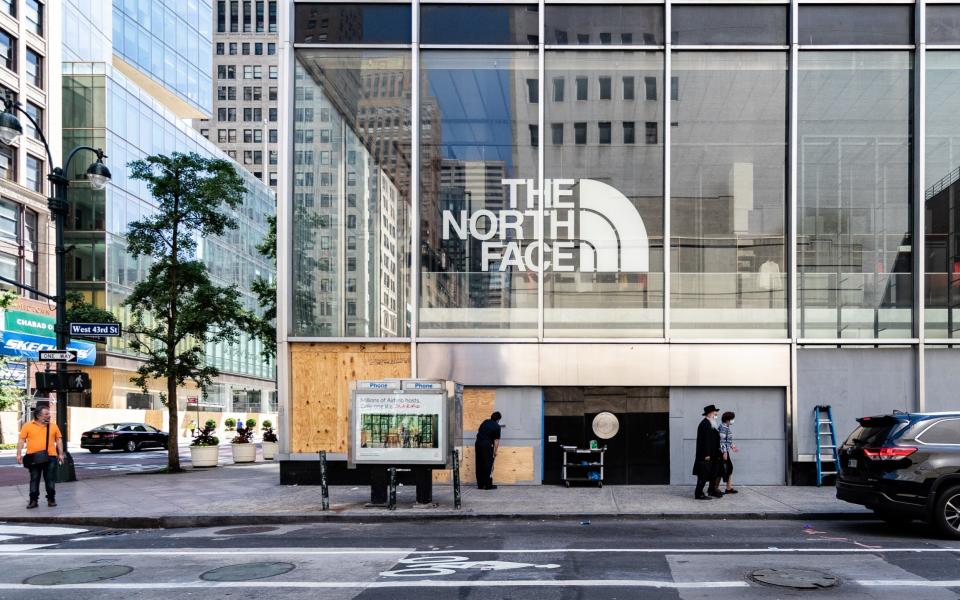 A boarded up North Face Inc. store stands in New York, U.S., on Tuesday, June 9, 2020. New York City, - Jeenah Moon /Bloomberg