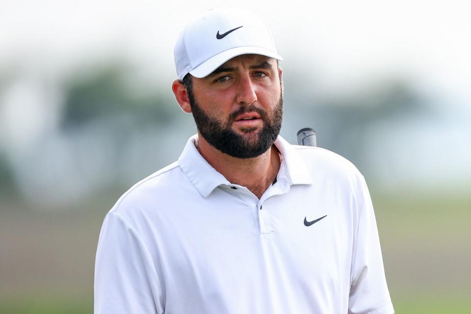 <p>Jared C. Tilton/Getty</p> Scottie Scheffler walks the 18th hole during the third round of the RBC Heritage at Harbour Town Golf Links on April 20, 2024