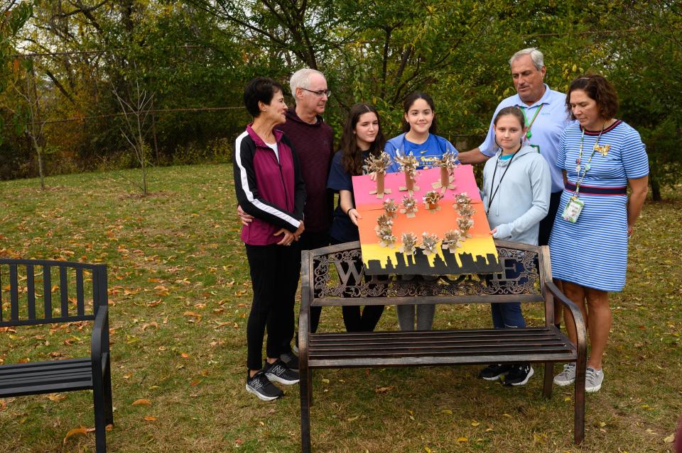 Andrea Wedner, left, the daughter of Rose Mallinger, one of the victims of the Tree of Life synagogue shooting, stands with her husband, Ron, as they join students at a unveiling of an art project on Wednesday, October 25, 2023, at Greenfield school in Pittsburgh. The art project will be displayed at the Oct. 27 commemoration ceremony where the students will also act as ambassadors to escort family members.