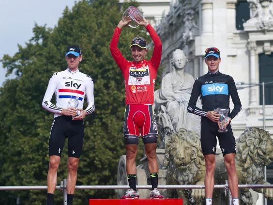 Juan Jose Cobo ( C ) finished 13 seconds ahead of Chris Froome in the 2011 race (Getty)