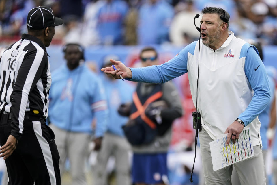 Tennessee Titans head coach Mike Vrabel speaks with an official during the first half of an NFL football game against the Houston Texans, Sunday, Dec. 17, 2023, in Nashville, Tenn. (AP Photo/George Walker IV)