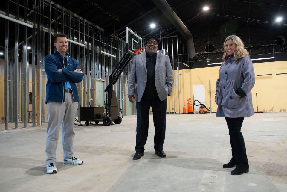 David Clark, Benny Washington and Lisa Bosarge talk Thursday about the future of the James B. Washington Education and Sports Inc. program during a tour of the organization's new building,