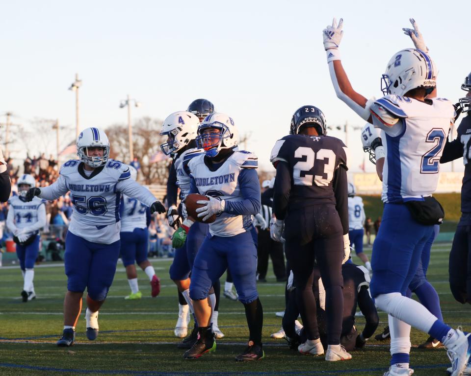 Middletown celebrates a score in Saturday's Division III Super Bowl Saturday in Cranston Stadium.