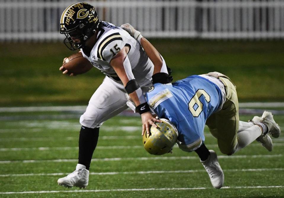 Camden’s Grayson White (15) carries the ball as Daniel’s Ben Joplin (9) try to make the stop in Saturday’s Class 3A championship game played at S.C. State University in Orangeburg. ALEX HICKS JR./USA TODAY NETWORK