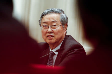 FILE PHOTO: China's central bank governor Zhou Xiaochuan speaks during a session on the second day of the 19th National Congress of the Communist Party of China at the Great Hall of the People in Beijing, October 19, 2017. REUTERS/Thomas Peter/File Photo