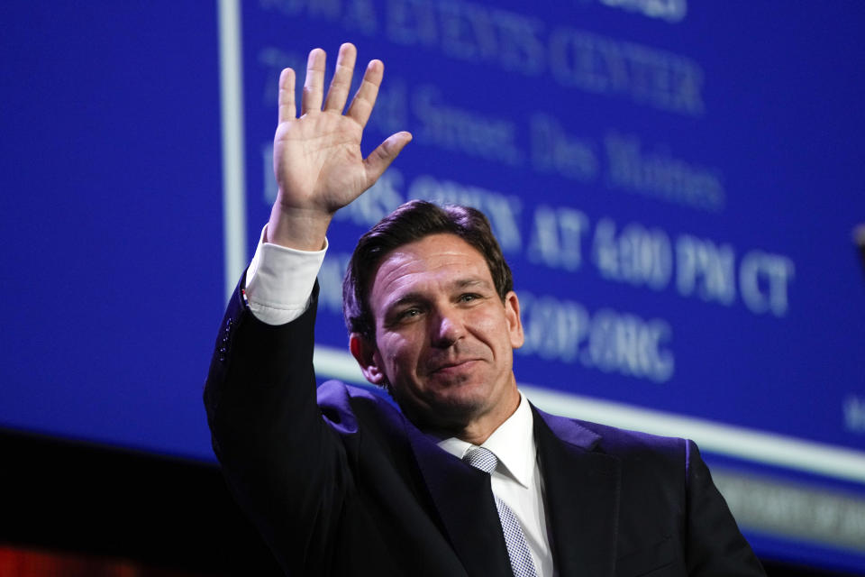 FILE - Republican presidential candidate Florida Gov. Ron DeSantis waves at the Republican Party of Iowa's 2023 Lincoln Dinner in Des Moines, Iowa, July 28, 2023. (AP Photo/Charlie Neibergall, File)