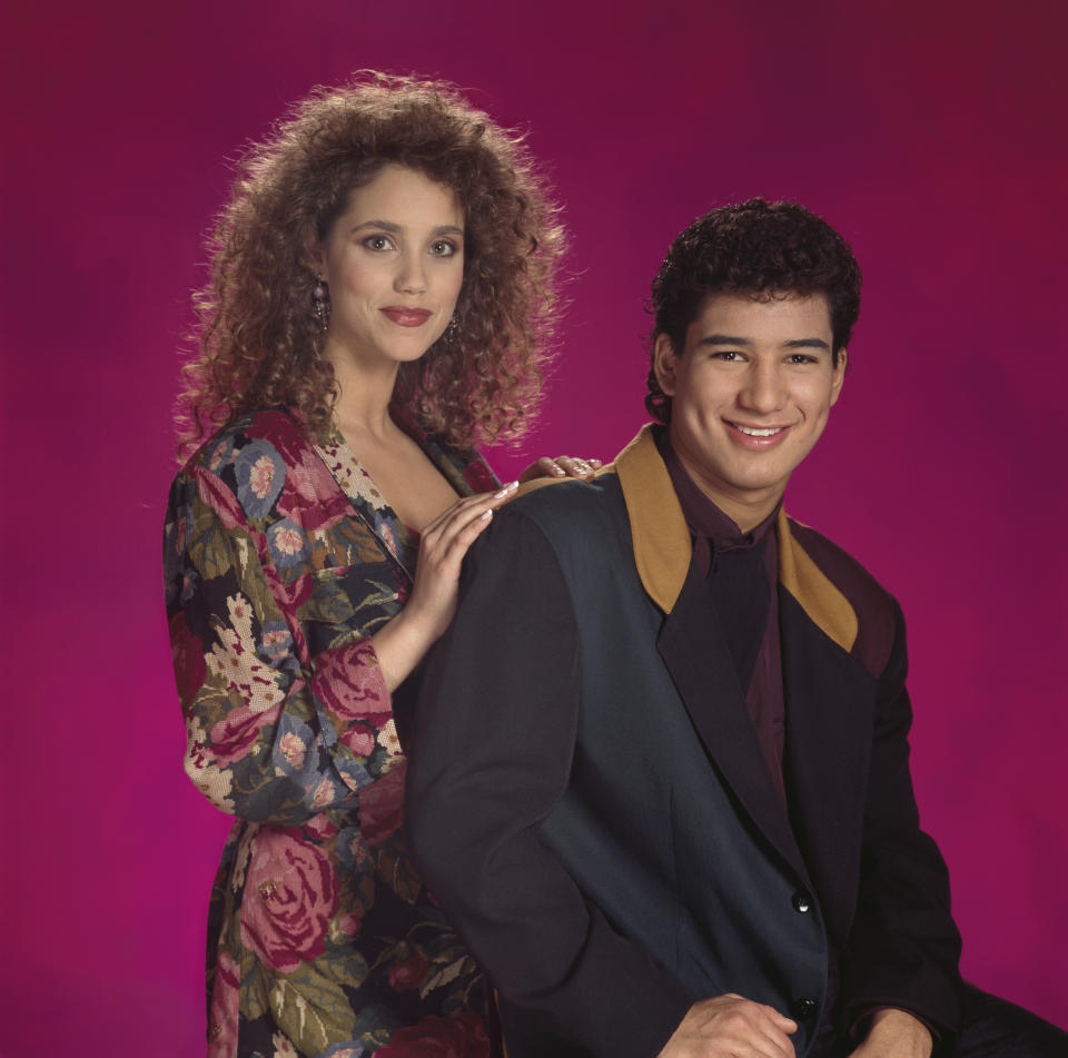 SAVED BY THE BELL -- Pictured: (l-r) Elizabeth Berkley as Jessie Spano, Mario L+?pez as A.C. Slater  (Photo by NBC/NBCU Photo Bank via Getty Images)