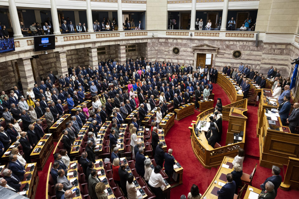 Greek lawmakers attend a swearing in ceremony at the parliament in Athens, Greece, Sunday, May 28, 2023. Newly elected Greek lawmakers were sworn in Sunday, but the Parliament elected on May 21 could be dissolved as early as Monday and a new election campaign start for another election, on June 25. (AP Photo/Yorgos Karahalis)