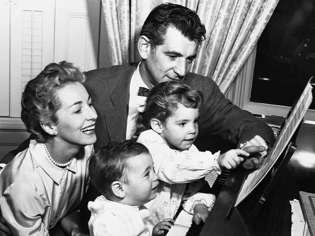 <p>Bettmann</p> Leonard Bernstein with his sons, Jamie and Alexander Serge, and his wife, Felicia Montealegre on Novemebr 20, 1957..