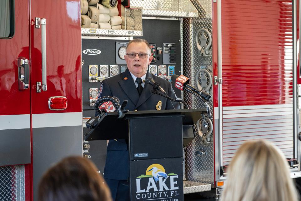 Lake County Fire Chief Jim Dickerson tells about Amos Roach's contributions to the community at the dedication ceremony at Station 21 in Eustis on Monday.