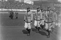 This photo provided by the Library of Congress, dated April 18, 1923, shows Babe Ruth, center, with New York Yankees teammates, at New York's Yankee Stadium. The 100th anniversary of the original Yankee Stadium is marked Tuesday, April 18, 2023, a ballpark that revolutionized baseball with its grandeur and the success of the team. (Library of Congress via AP)