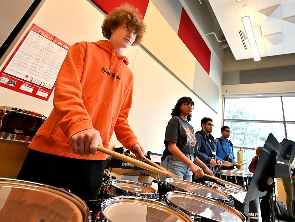 Drummer Ethan Katz plays with the percussion section as the South High band rehearses in preparation for the Worcester County St. Patrick's Parade.
