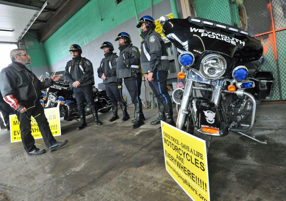 Paul Cote, American Motorcyclist Association Massachusetts Chapter coordinator, left, talks with Weymouth police motorcycle officers, from second left, Lt. Brian Morse and officers Kenny Sanchez, Darren King and Ryan Killeen.