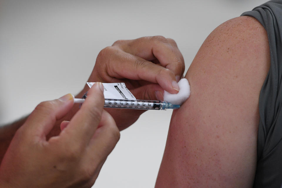 person receiving Covid vaccine