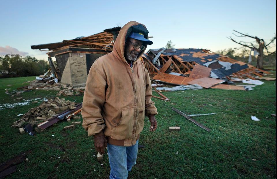 Willie Meeds walks from a relative's home after helping turn off the houses water main after a tornado hit in Powderly, Texas, Saturday, Nov. 5, 2022.