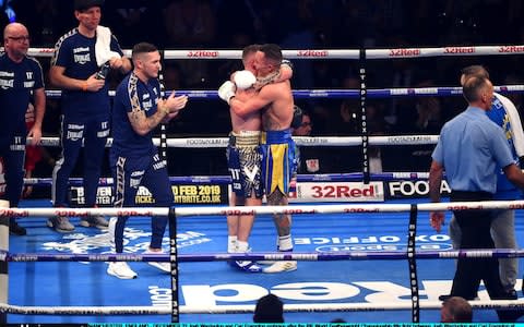 Frampton and Warrington embrace after a thrilling contest - Credit: Getty Images