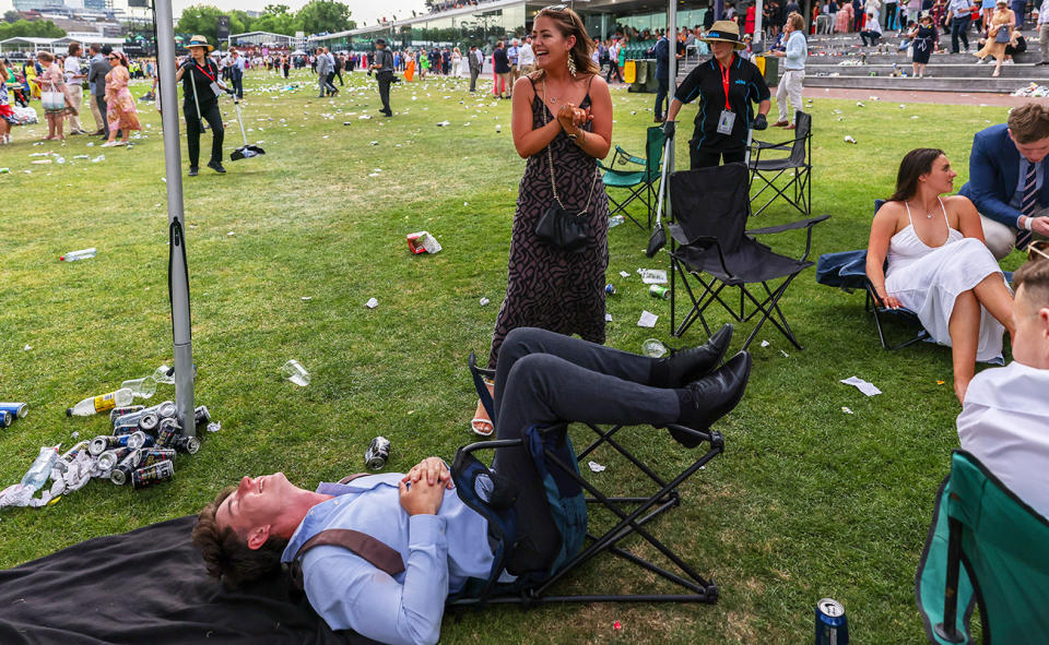 A racegoer, pictured here after falling over on his chair.