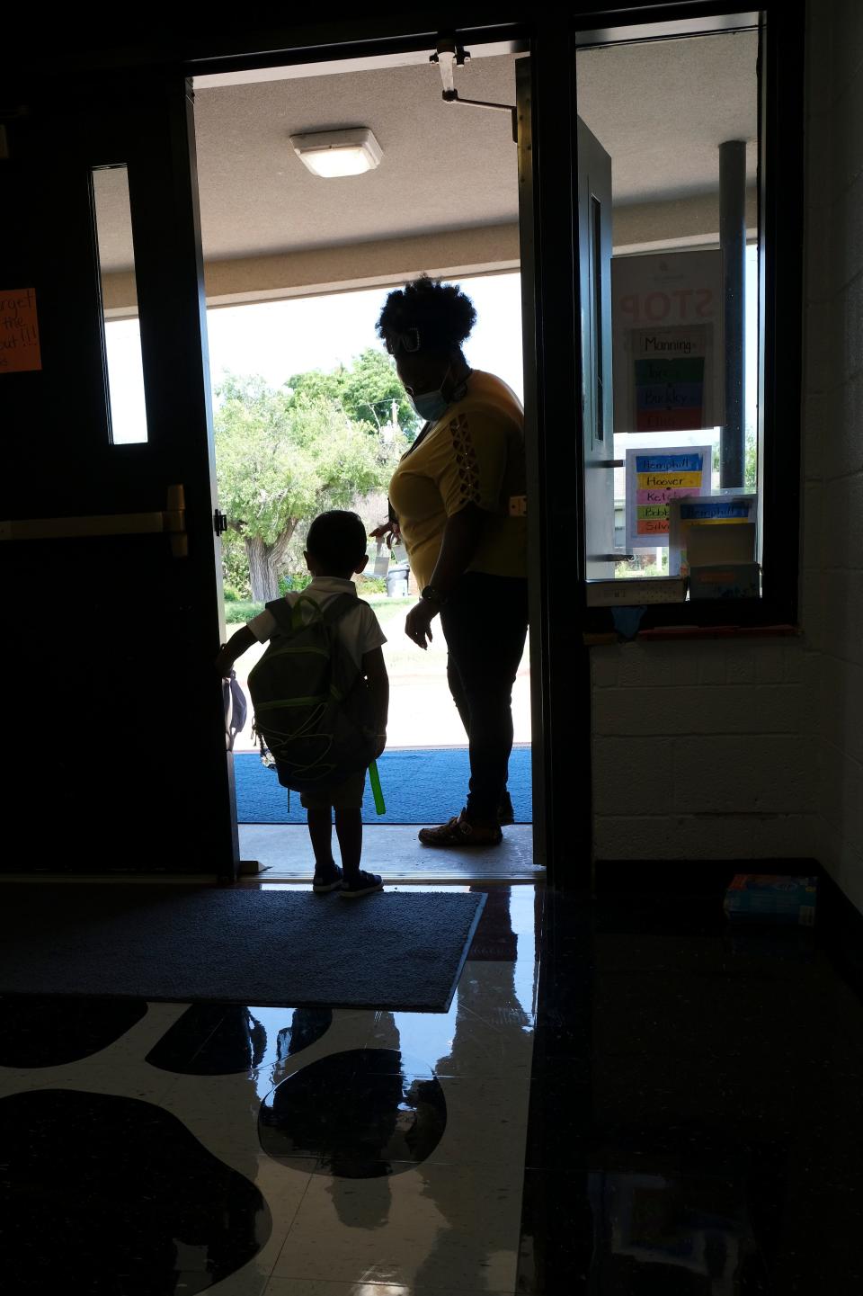 A child waits for his ride at the door. Children end their first day of school at Andrew Johnson Pre-K Center, as Oklahoma City Public Schools started back up Monday, August 9, 2021.