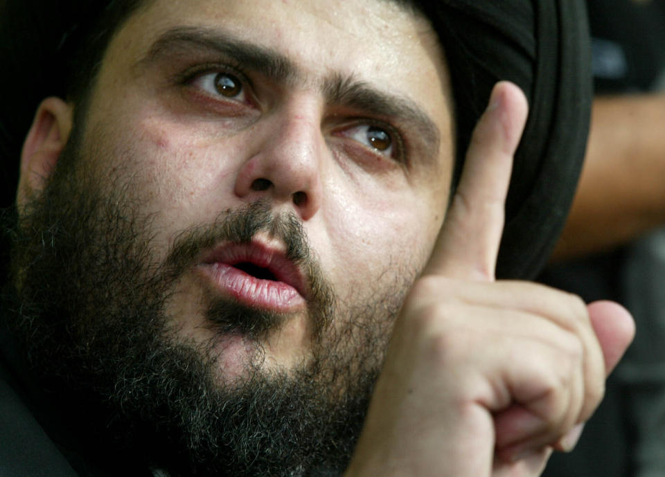 FILE - Radical Shiite Muslim cleric Muqtada al-Sadr speaks at a news conference in Najaf, 165 kilometers (100 miles) south of Baghdad, Oct. 14, 2003. Al-Sadr is a populist cleric, who emerged as a symbol of resistance against the U.S. occupation of Iraq after the 2003 invasion. (AP Photo/Greg Baker, File)