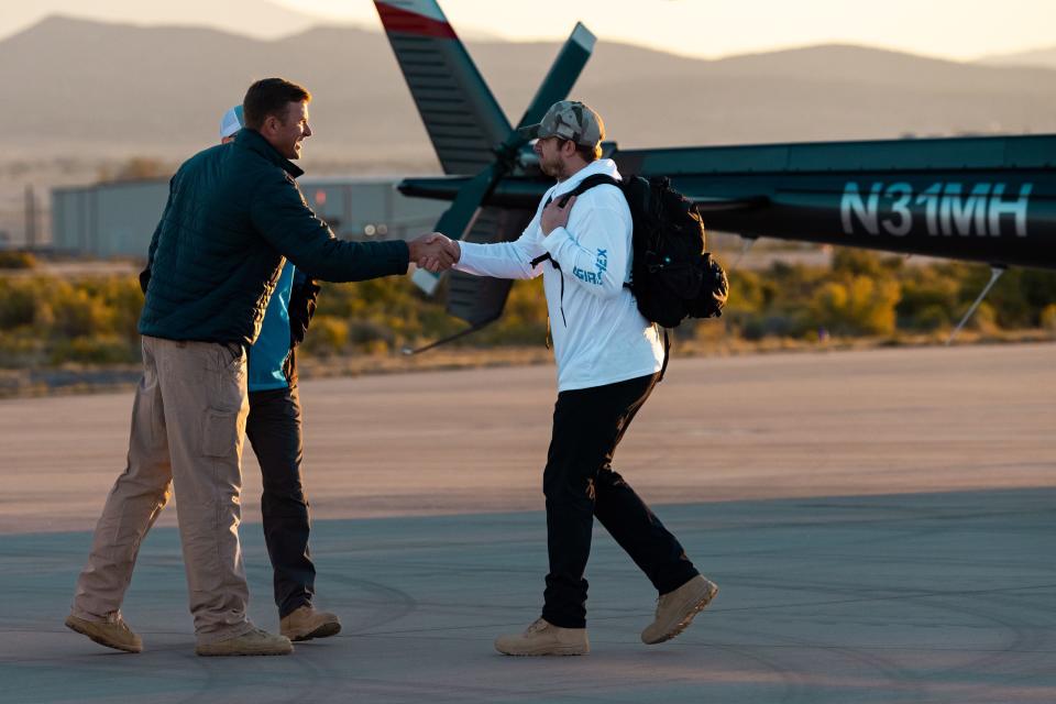 Helicopter pilots greet members of the sample recovery team before taking off to collect the capsule containing a sample collected from the Bennu asteroid as part of NASA’s Osiris-Rex mission at the U.S. Army’s Dugway Proving Ground in Dugway on Sunday, Sept. 24, 2023. | Megan Nielsen, Deseret News