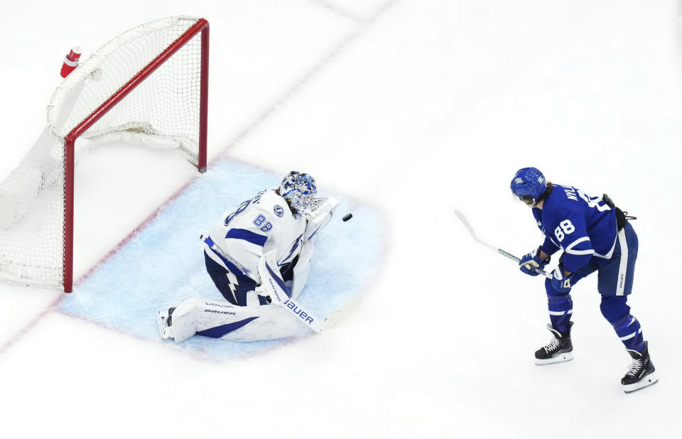 Tampa Bay Lightning goaltender Andrei Vasilevskiy makes a save on Toronto Maple Leafs' William Nylander during the third period of an NHL hockey game Wednesday, April 3, 2024, in Toronto. (Chris Young/The Canadian Press via AP)