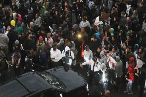 Supporters of Trayvon Martin march in New York City on March 21. The police chief at the center of a growing storm in the United States over the fatal shooting of an unarmed black teenager by a white crime watch volunteer stepped down temporarily Thursday