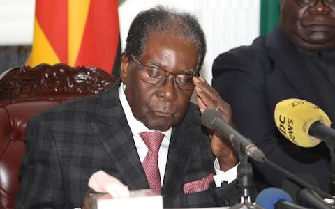 Zimbabwean President Robert Mugabe delivers his speech during a live broadcast at State House in Harare - Credit: AP Photo