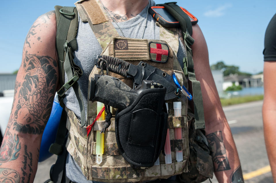 Volunteer rescuer Ryan Wilkenfeld, 32, from Houston, wears a gun vest in Port Arthur.