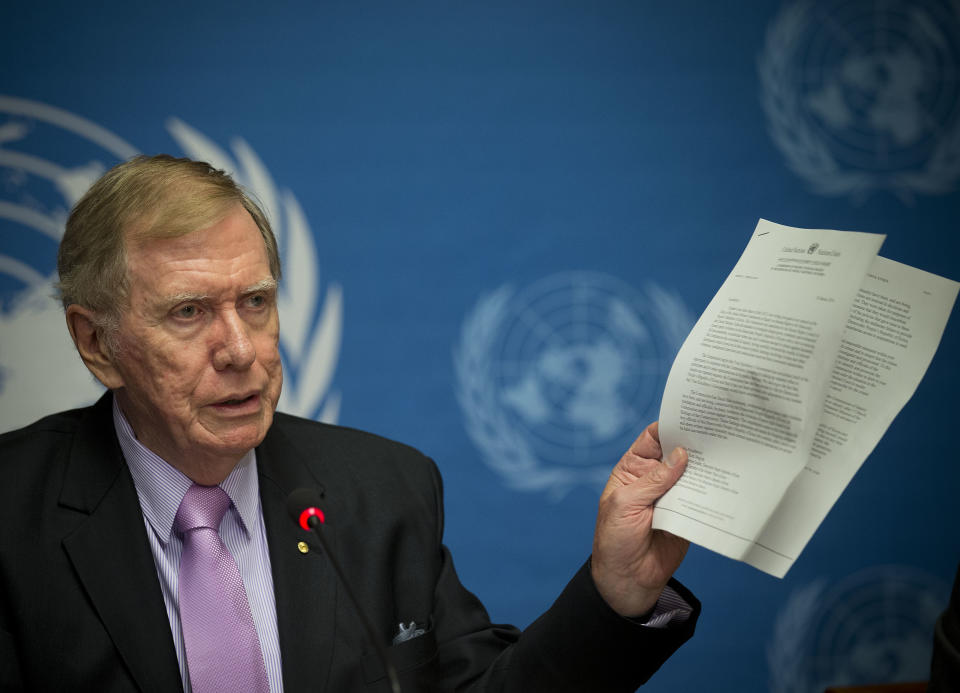 Retired Australian judge Michael Kirby, chairperson of the commission of Inquiry on Human Rights in the Democratic People's Republic of Korea, shows a UN letter to North Korean leader warning on-accountability for 'crimes during a press conference at the United Nations in Geneva, Switzerland, Monday, Feb. 17, 2014. A U.N. panel has warned North Korean leader Kim Jong Un that he may be held accountable for orchestrating widespread crimes against civilians in the secretive Asian nation. Kirby told the leader in a letter accompanying a yearlong investigative report on North Korea that international prosecution is needed "to render accountable all those, including possibly yourself, who may be responsible for crimes against humanity." (AP Photo/Anja Niedringhaus)