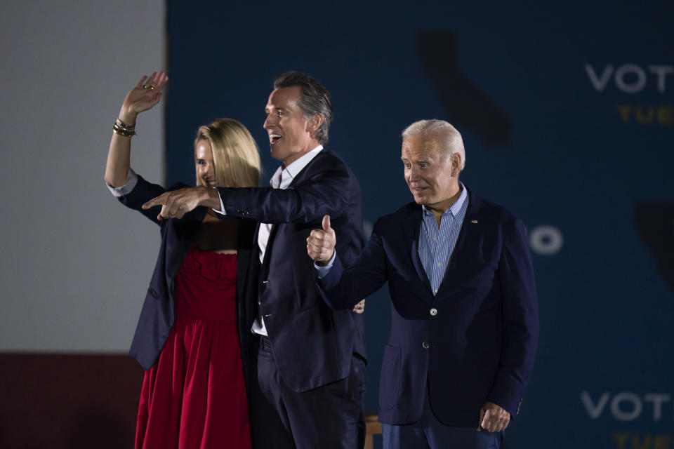 President Joe Biden, right, gives a thumb up as California Gov. Gavin Newsom, and wife, Jennifer Siebel Newsom, wave to their supporters at a rally ahead of the California gubernatorial recall election Monday, Sept. 13, 2021, in Long Beach, Calif. (AP Photo/Jae C. Hong)