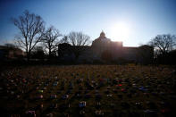 Activists install 7000 shoes on the lawn in front of the U.S. Capitol on Capitol Hill in Washington, U.S. March 13, 2018. REUTERS/Eric Thayer