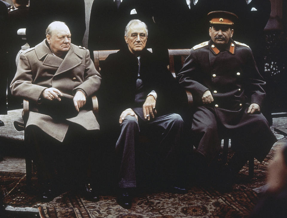FILE - From left, British Prime Minister Winston Churchill, U.S. President Franklin Roosevelt and Soviet Premier Josef Stalin sit on the patio of Livadia Palace, Yalta, Crimea, Feb. 4, 1945,. The Crimean Peninsula's balmy beaches have been vacation spots for Russian czars and has hosted history-shaking meetings of world leaders. And it has been the site of ethnic persecutions, forced deportations and political repression. Now, as Russia’s war in Ukraine enters its 18th month, the Black Sea peninsula is again both a playground and a battleground.(AP Photo/File)