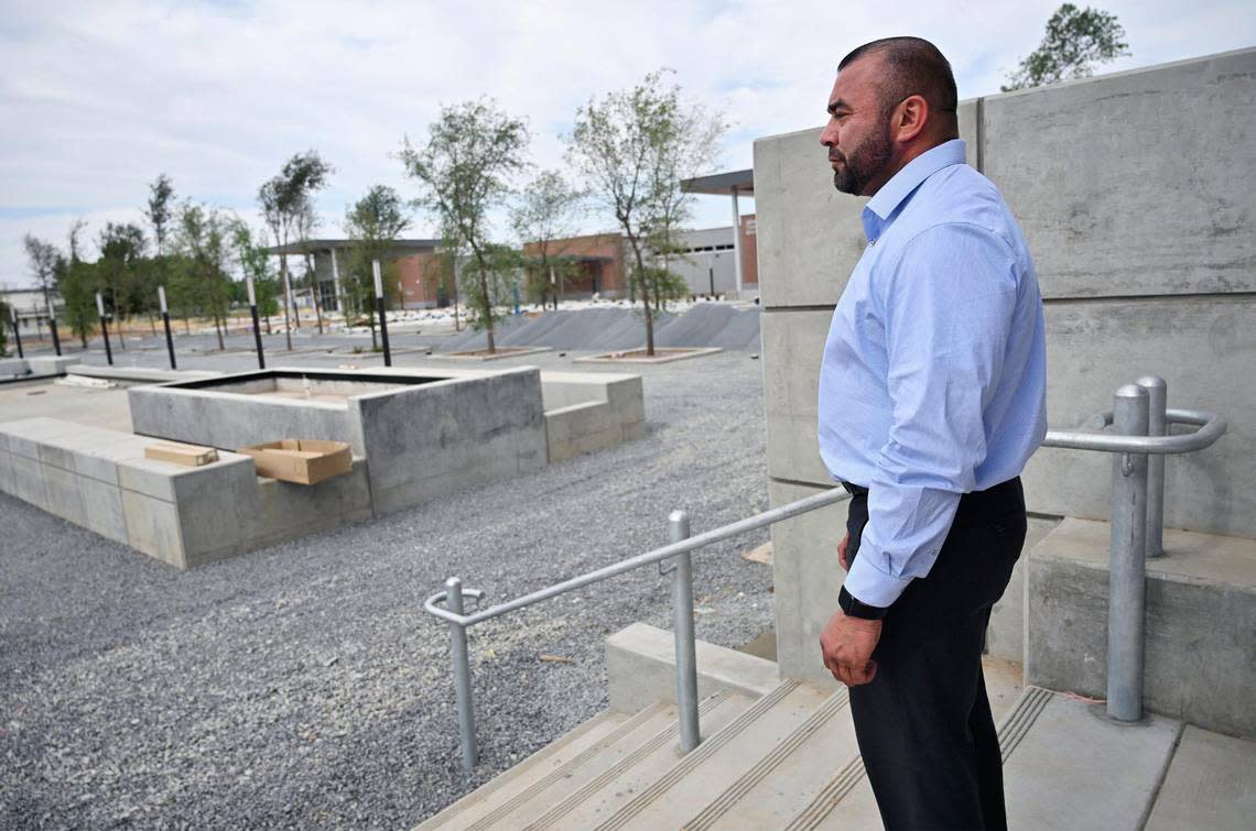 Fresno City College President Dr. Robert Pimentel looks out from the front steps of Fresno City College’s new west Fresno campus, still under construction on Thursday, June 22, 2023.
