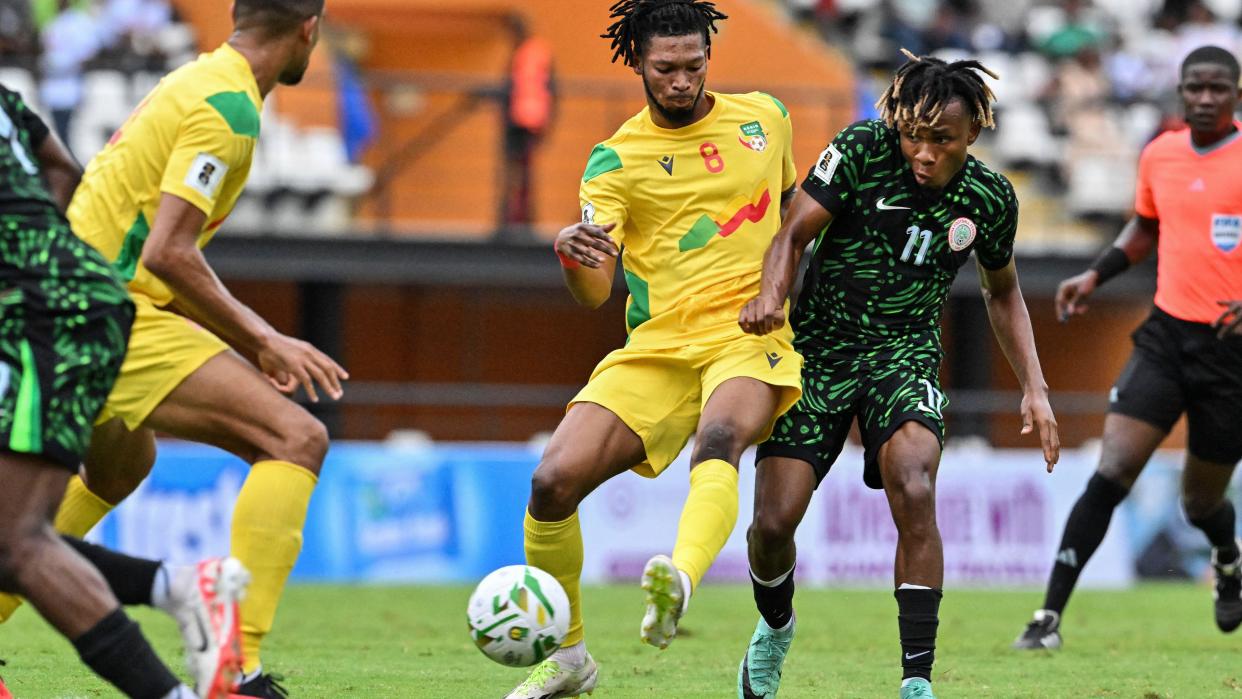 Nigeria's Samuel Chukwueze (right) battles for the ball with Benin's  Hassane Imourane