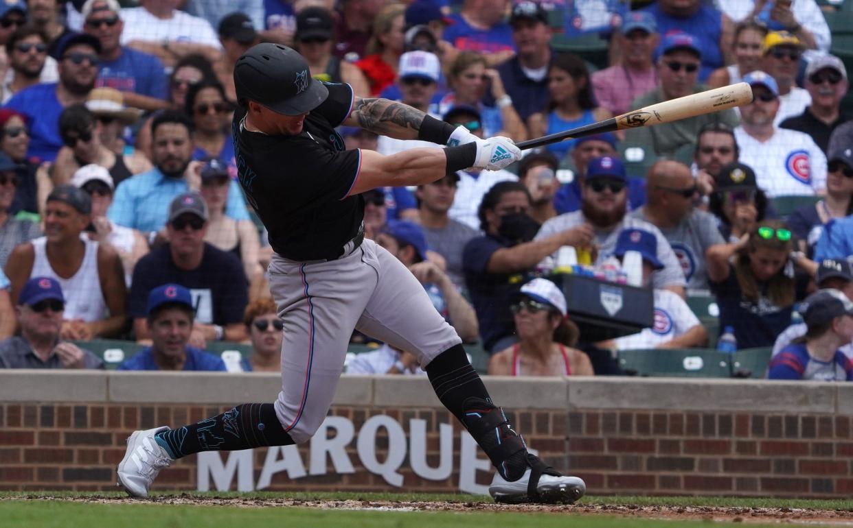 Miami Marlins left fielder Peyton Burdick (86) gets his first major league baseball hit against the Chicago Cubs during the third inning at Wrigley Field in Chicago on Aug. 6.